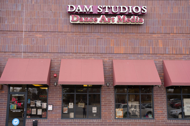 Store front with Dance Art Media Studios sign in Littleton